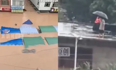 Bão Narra càn quét gây lũ lớn ngập đến tầng 2, người dân suy sụp đứng trên mái nhà cầu cứu