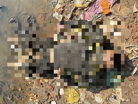 Phát hiện thi thể người đàn ông đeo khẩu trang dưới cằm nằm ngửa bên bờ sông