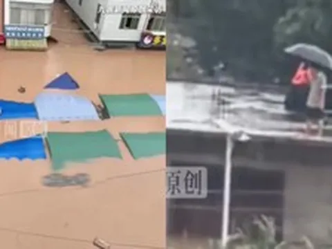 Bão Narra càn quét gây lũ lớn ngập đến tầng 2, người dân suy sụp đứng trên mái nhà cầu cứu